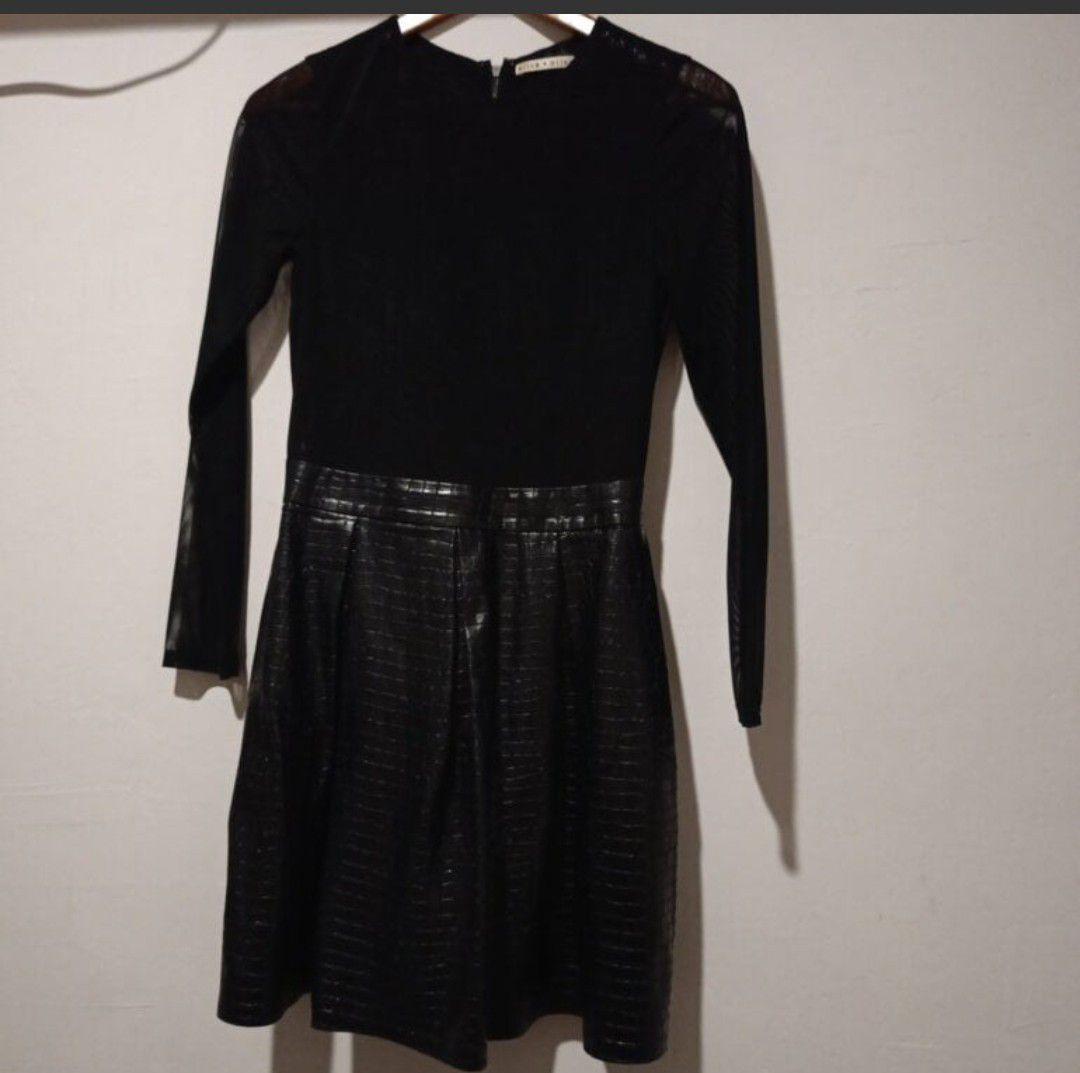 Vestido negro con falda de vinipiel y manga transparente