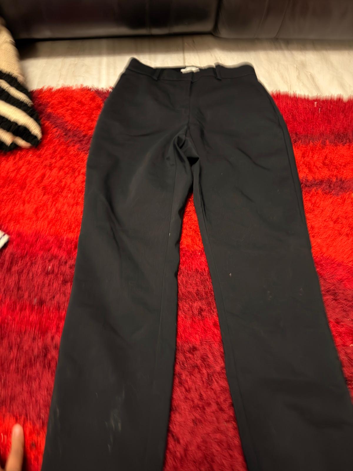 Pantalones negros de mujer en buen estado