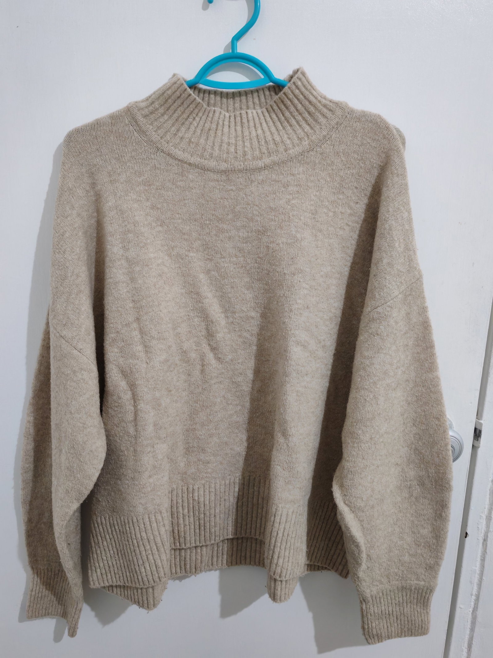 Suéter abrigador color crema