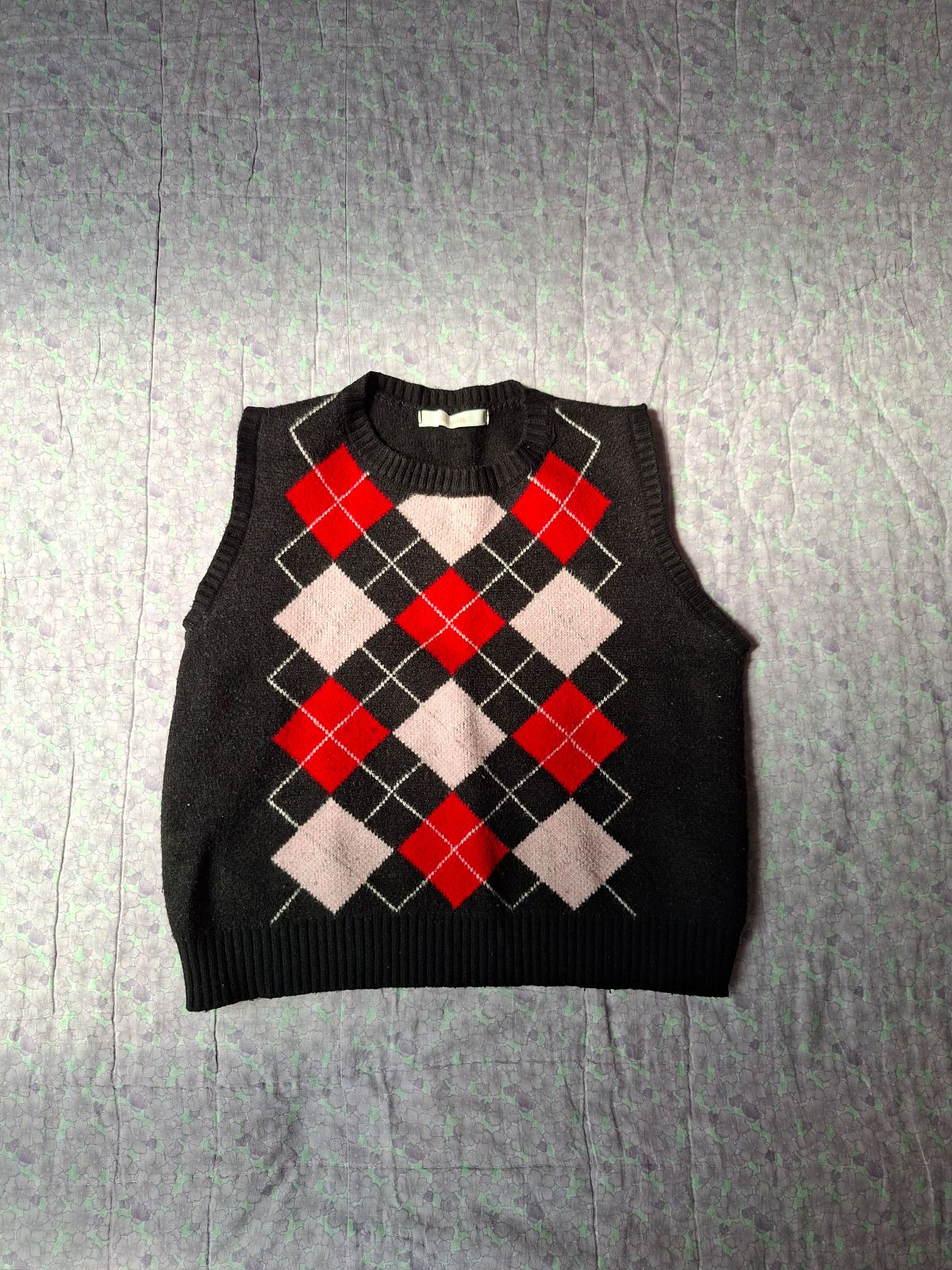 Chaleco de lana con diseño a cuadros en rojo y negro