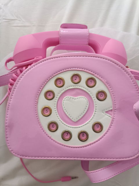 Bolsa de teléfono con bocina real contesta llamadas desde el celular.
